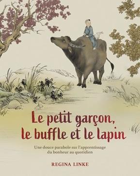 Le petit garçon, le buffle et le lapin